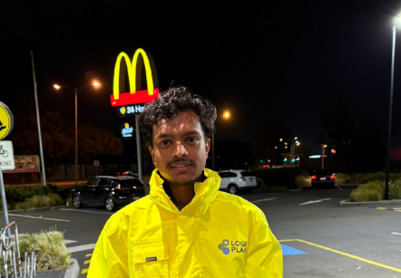 A LogiPlan team member in branded hi-vis on an after-hours commercial cleaning shift at a Melbourne site